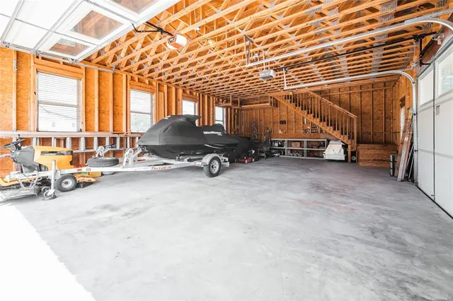 a view of parking garage with cars