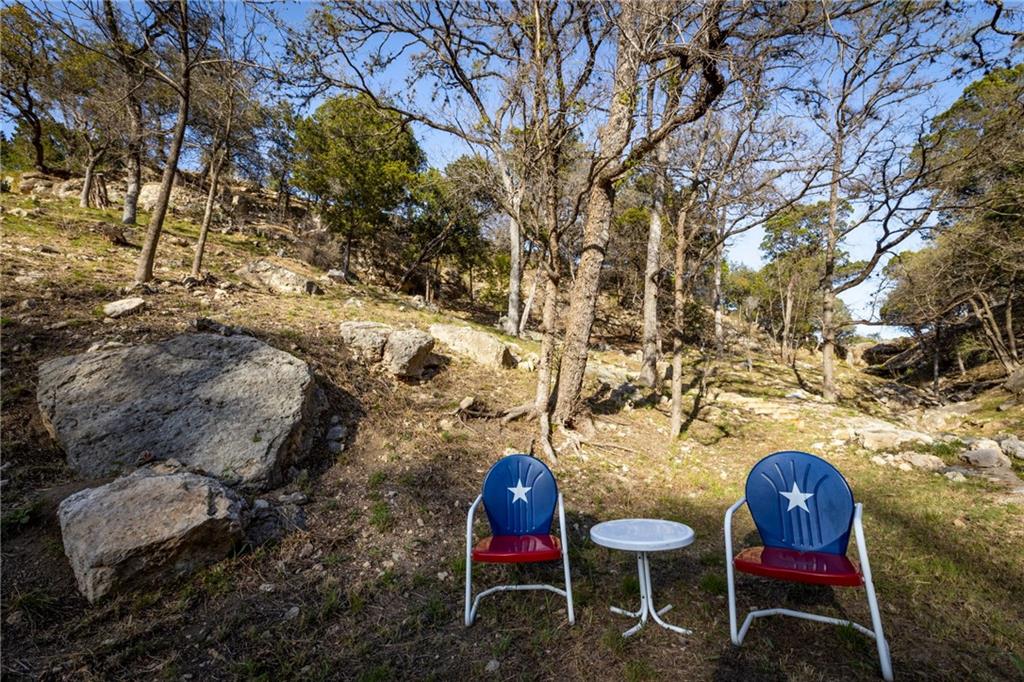5300 Lookout Ridge Drive Marble Falls, TX 78654 - Photo 40 of 40 a backyard of a house with table and chairs