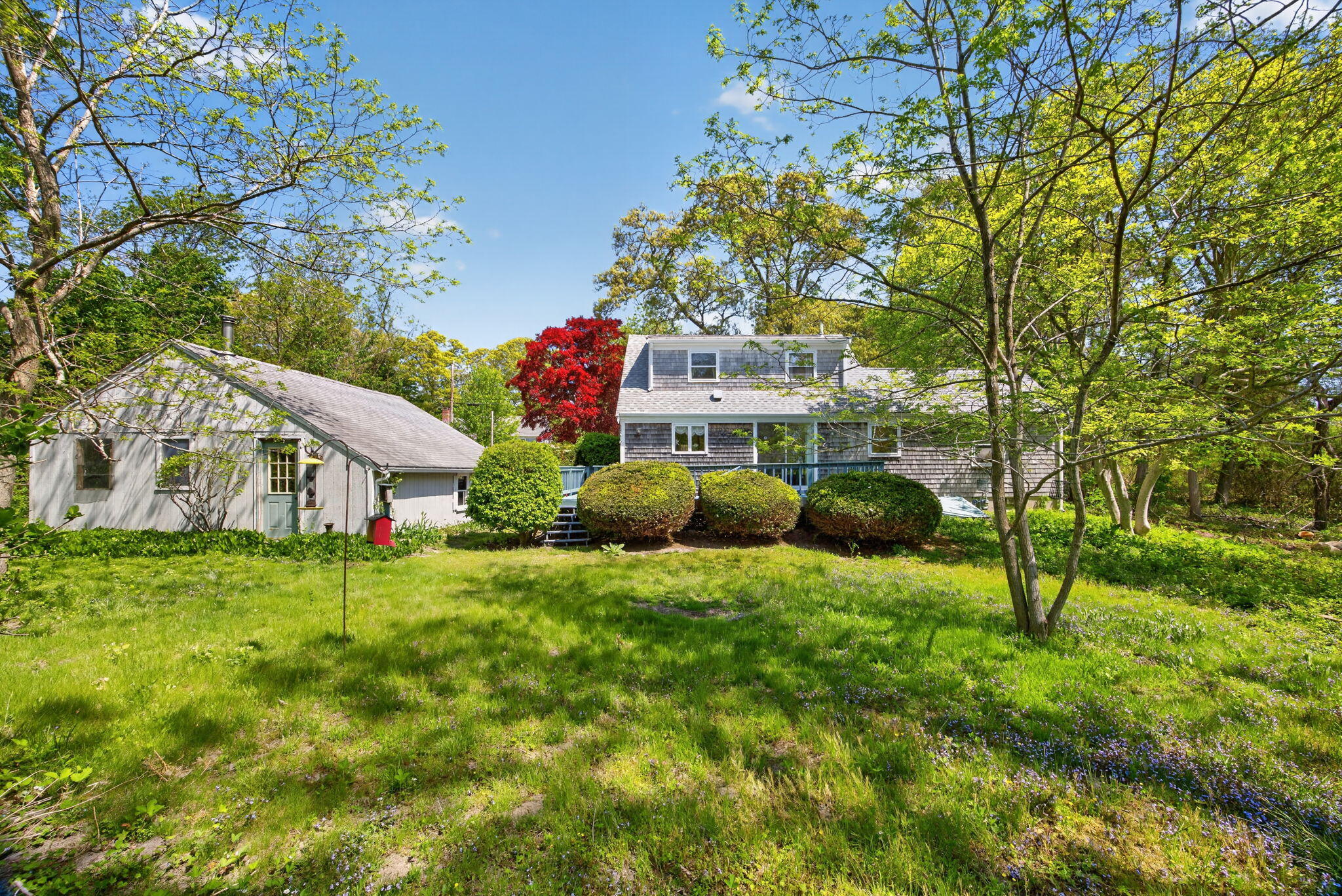 23 Nickerson Road Orleans, MA 02653 - Photo 30 of 54 a view of a house with a big yard and large trees