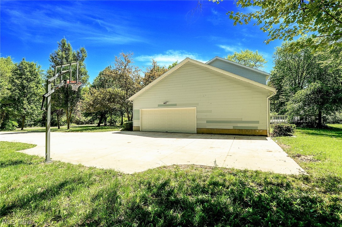 3432 Shellhart Road Barberton, OH 44203 - Photo 2 of 33 *NEWER WIDE REINFORCED CONCRETE DRIVEWAY W/BASKETBALL HOOP AND ATTACHED 2 CAR GARAGE ~