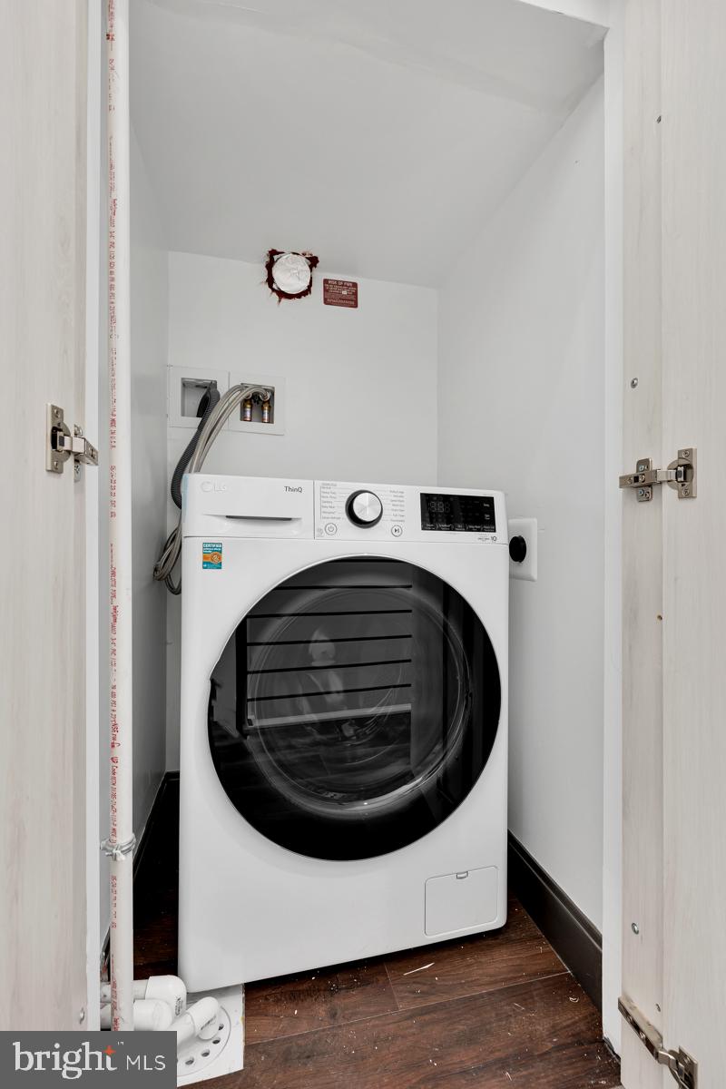 506 H Street Northeast, Unit 401 Washington, DC 20002 - Photo 17 of 19 a utility room with dryer and washer