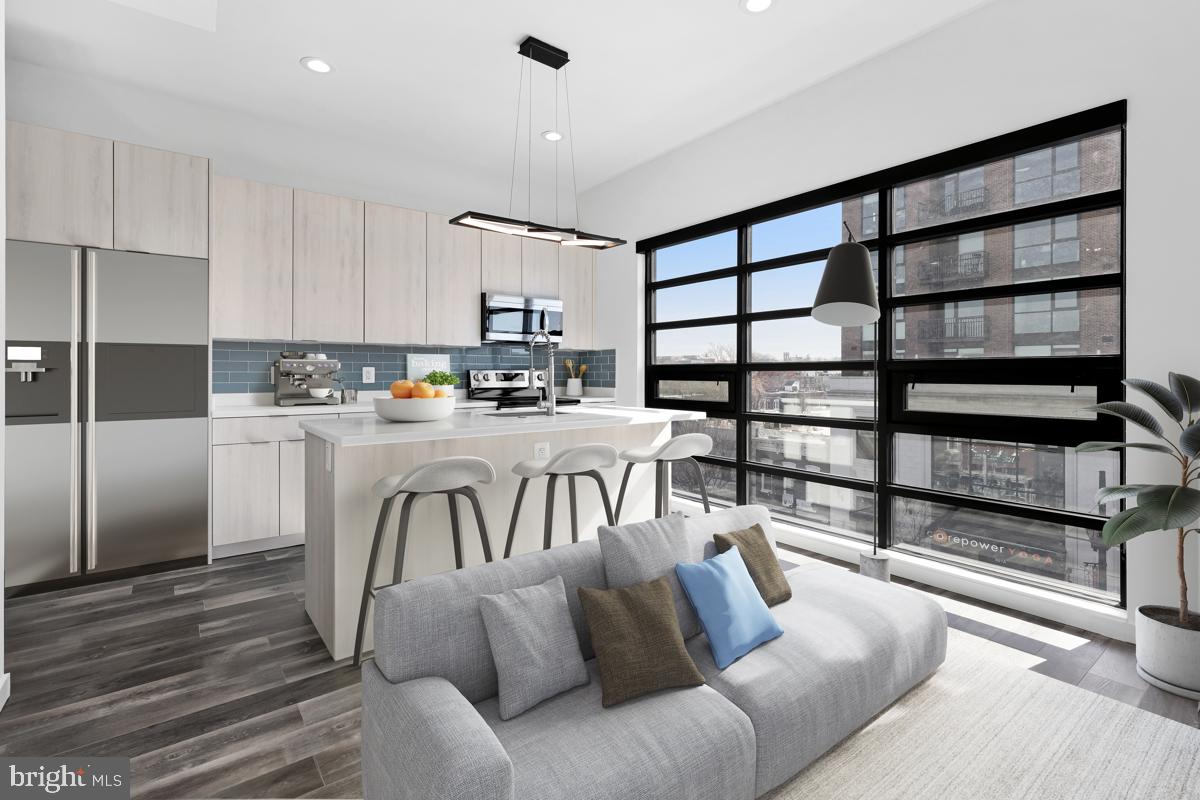506 H Street Northeast, Unit 401 Washington, DC 20002 - Photo 2 of 19 a living room with furniture a rug and white kitchen view