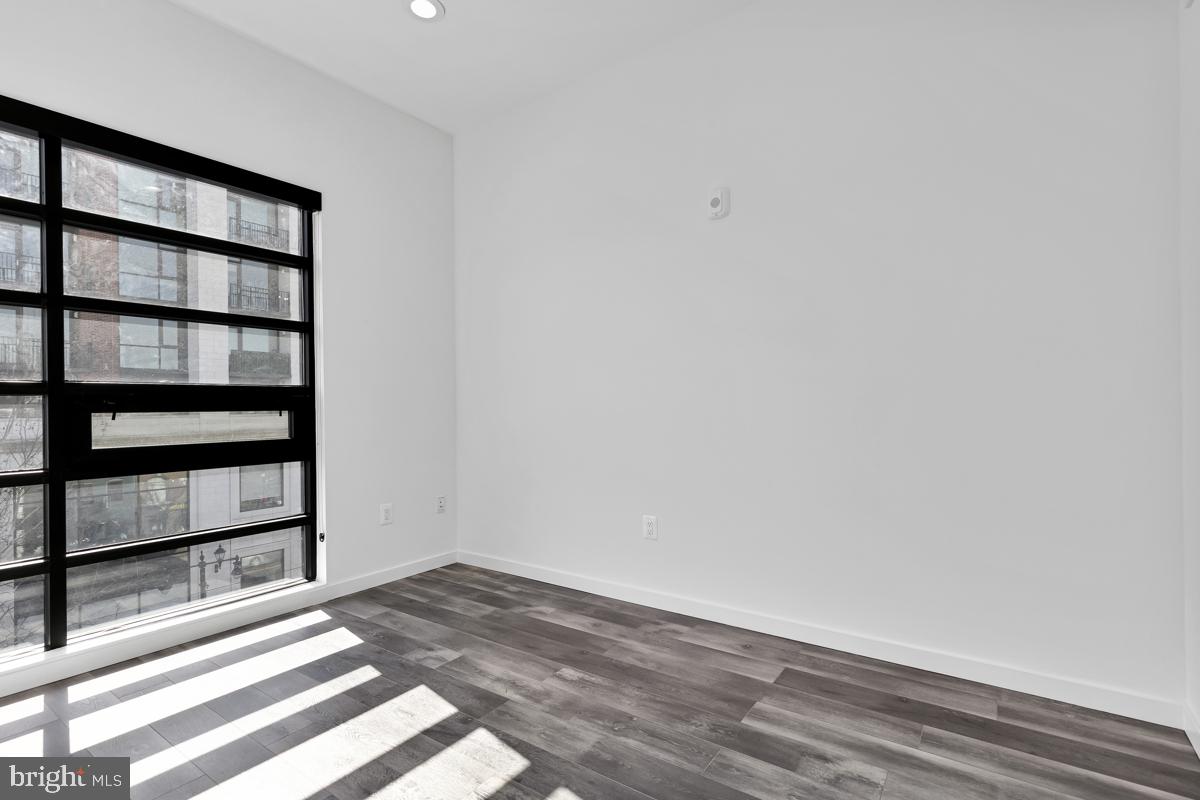 506 H Street Northeast, Unit 401 Washington, DC 20002 - Photo 6 of 19 a view of a room with empty racks
