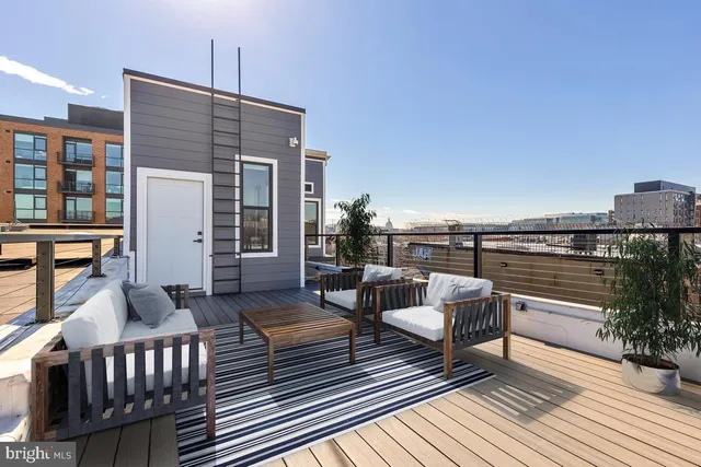 swimming pool view with a seating space