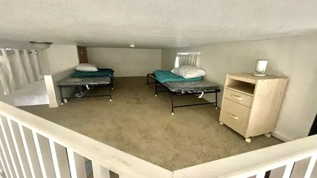a view of balcony with chair and wooden floor