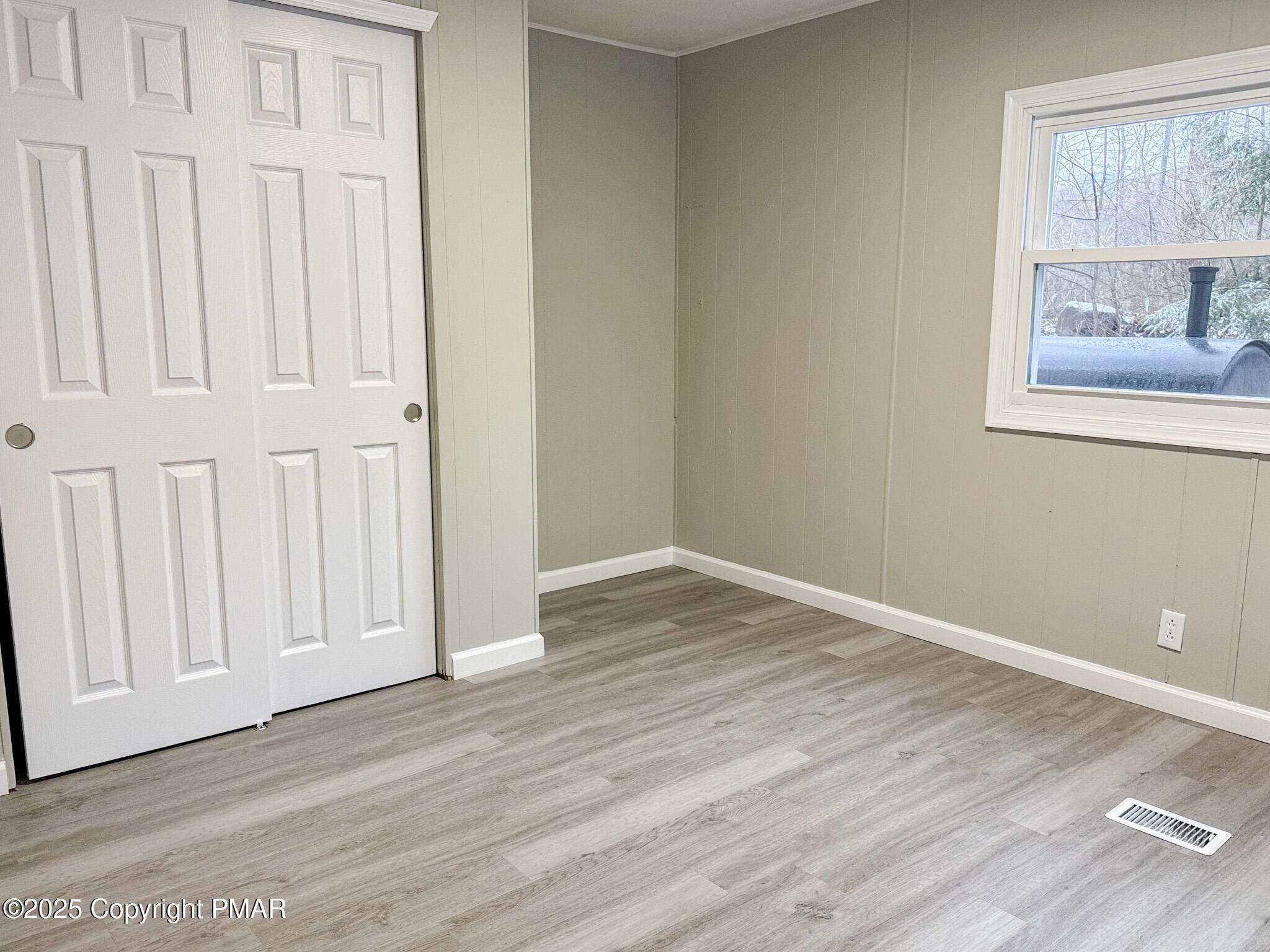 151 Bartion Court Bartonsville, PA 18321 - Photo 16 of 23 an empty room with wooden floor and windows