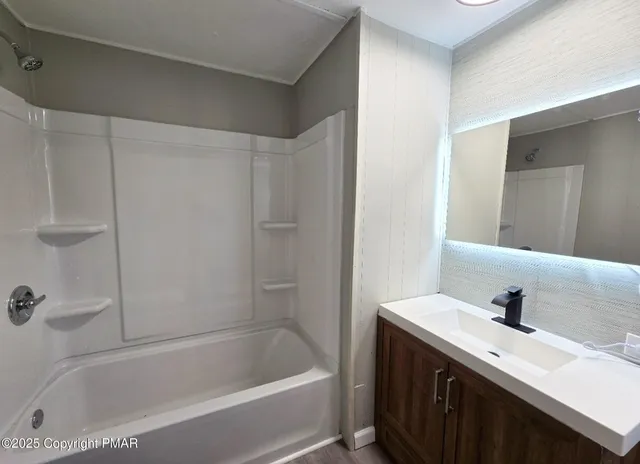 a view of a hallway with wooden shelves