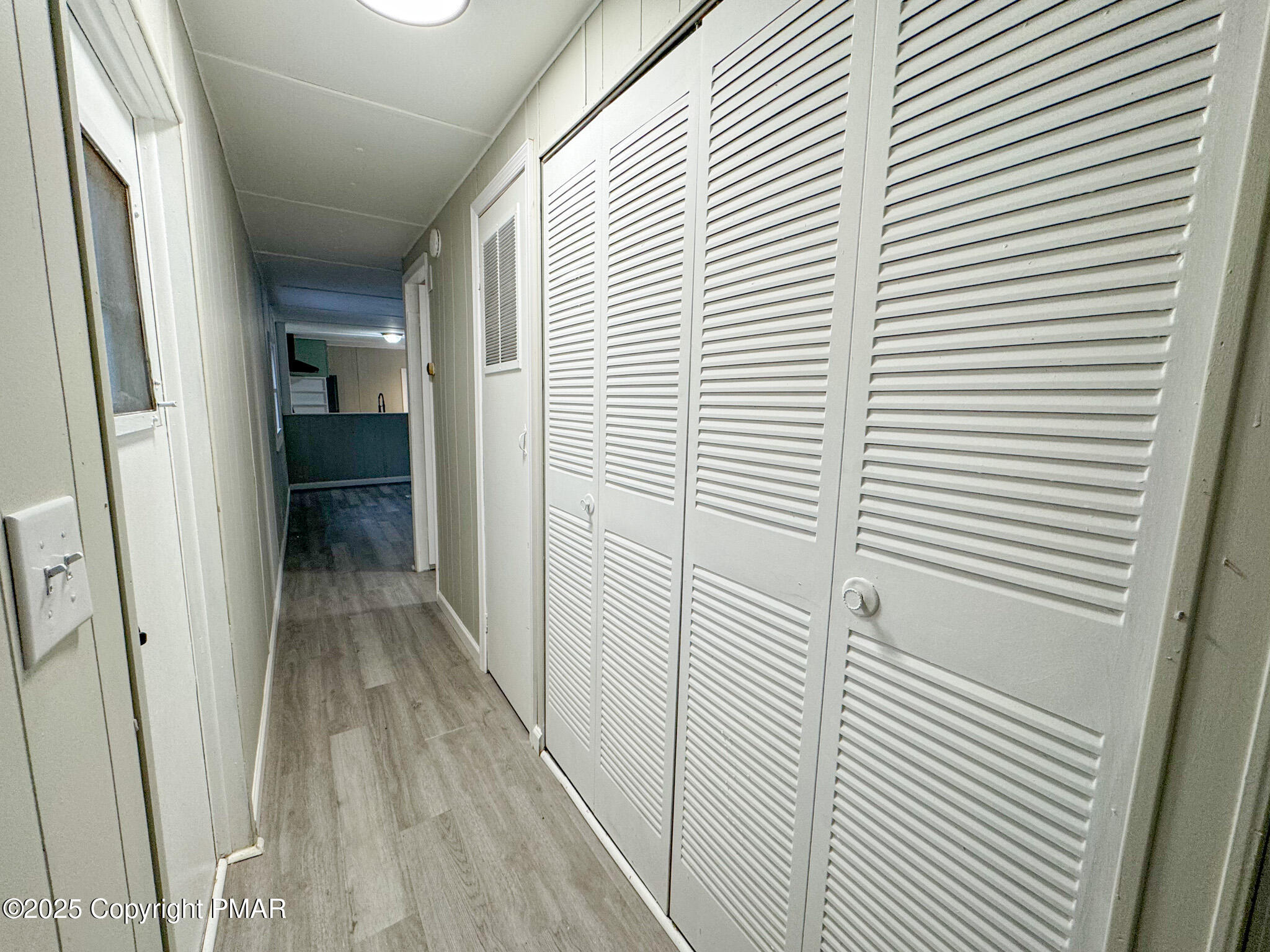 151 Bartion Court Bartonsville, PA 18321 - Photo 19 of 23 a view of a hallway with wooden shelves
