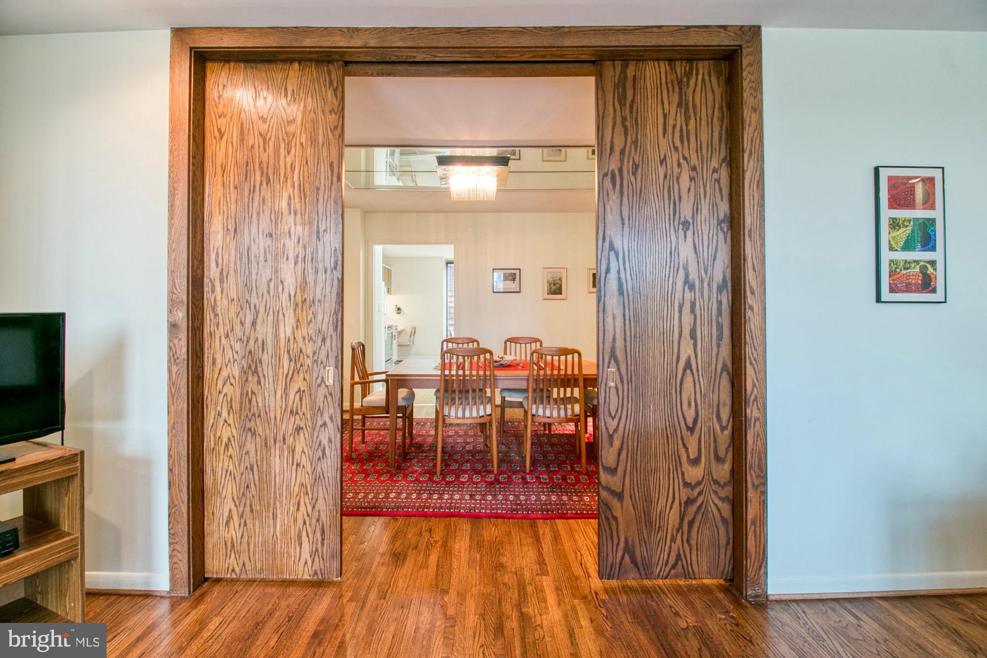 508 Old Crossing Drive Baltimore, MD 21208 - Photo 14 of 47 Pocket doors between living room and dining room