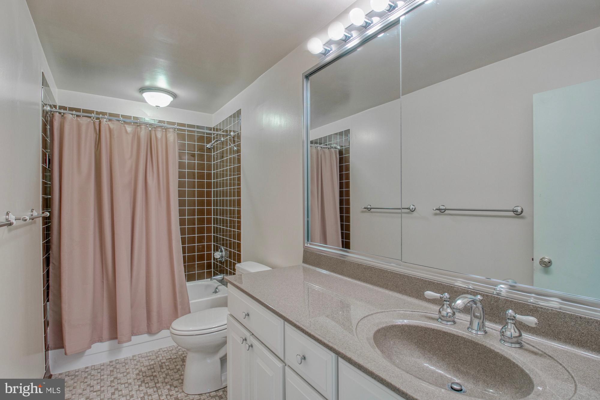 508 Old Crossing Drive Baltimore, MD 21208 - Photo 34 of 47 Upper level hall bath with tub and large vanity