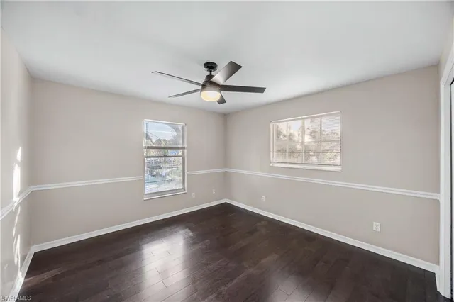 a bathroom with a tub a sink and mirrors
