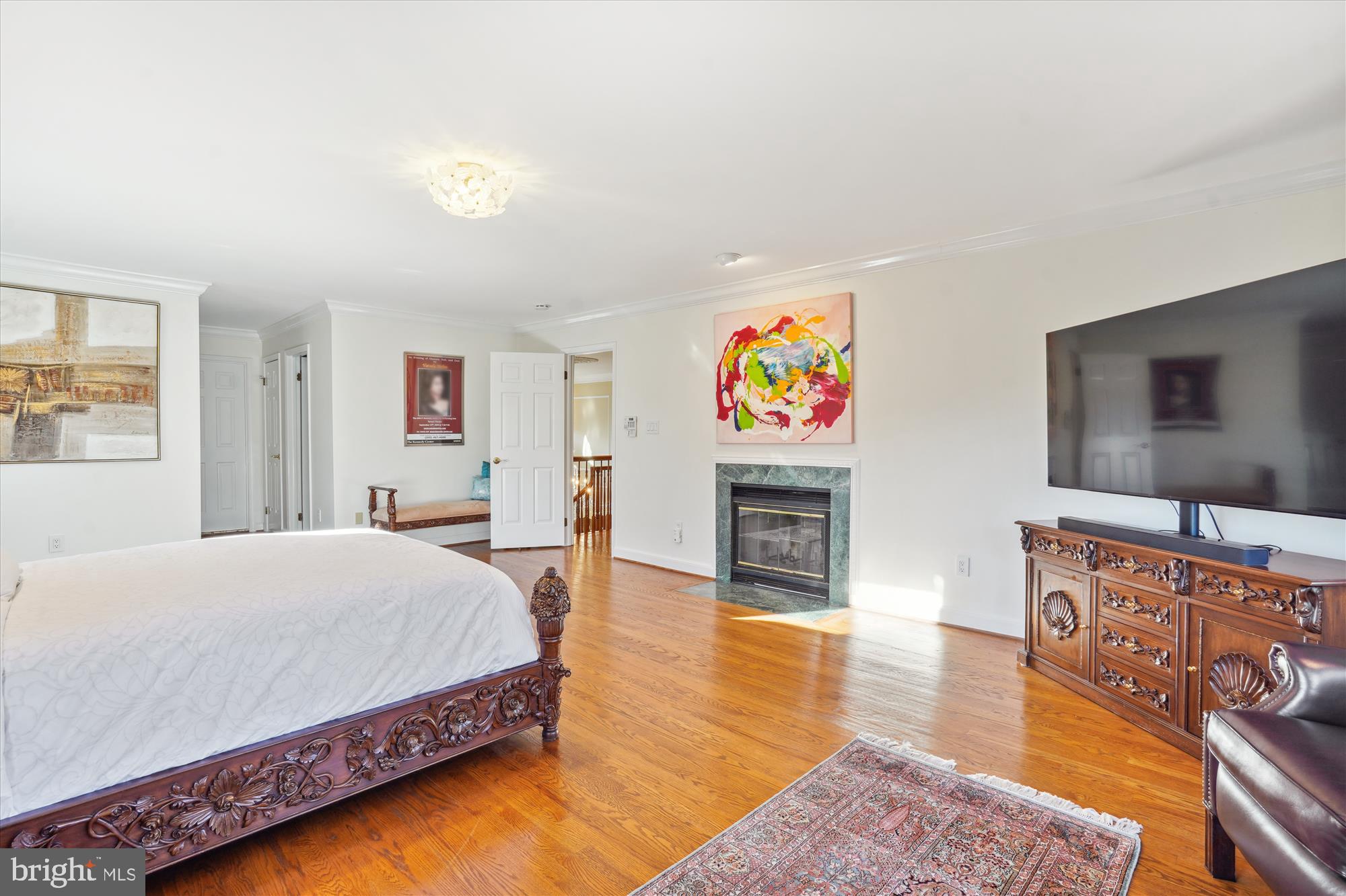 1071 Spring Hill Road McLean, VA 22102 - Photo 23 of 65 a bedroom with a bed and a flat screen tv