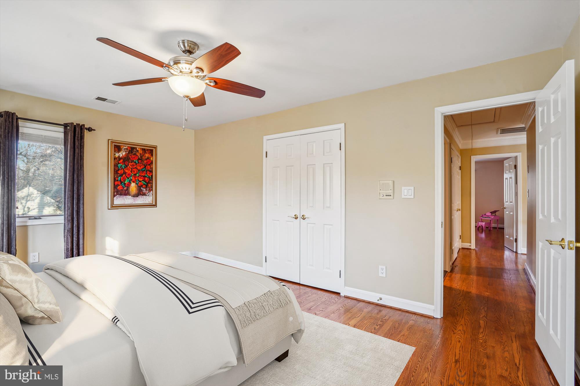 1071 Spring Hill Road McLean, VA 22102 - Photo 31 of 65 a bedroom with a large bed and a chandelier