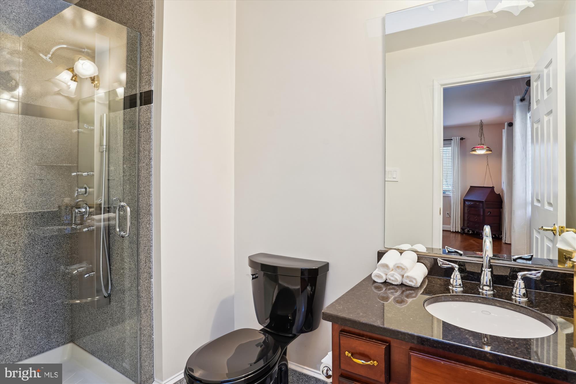 1071 Spring Hill Road McLean, VA 22102 - Photo 32 of 65 a bathroom with a sink vanity granite and a mirror