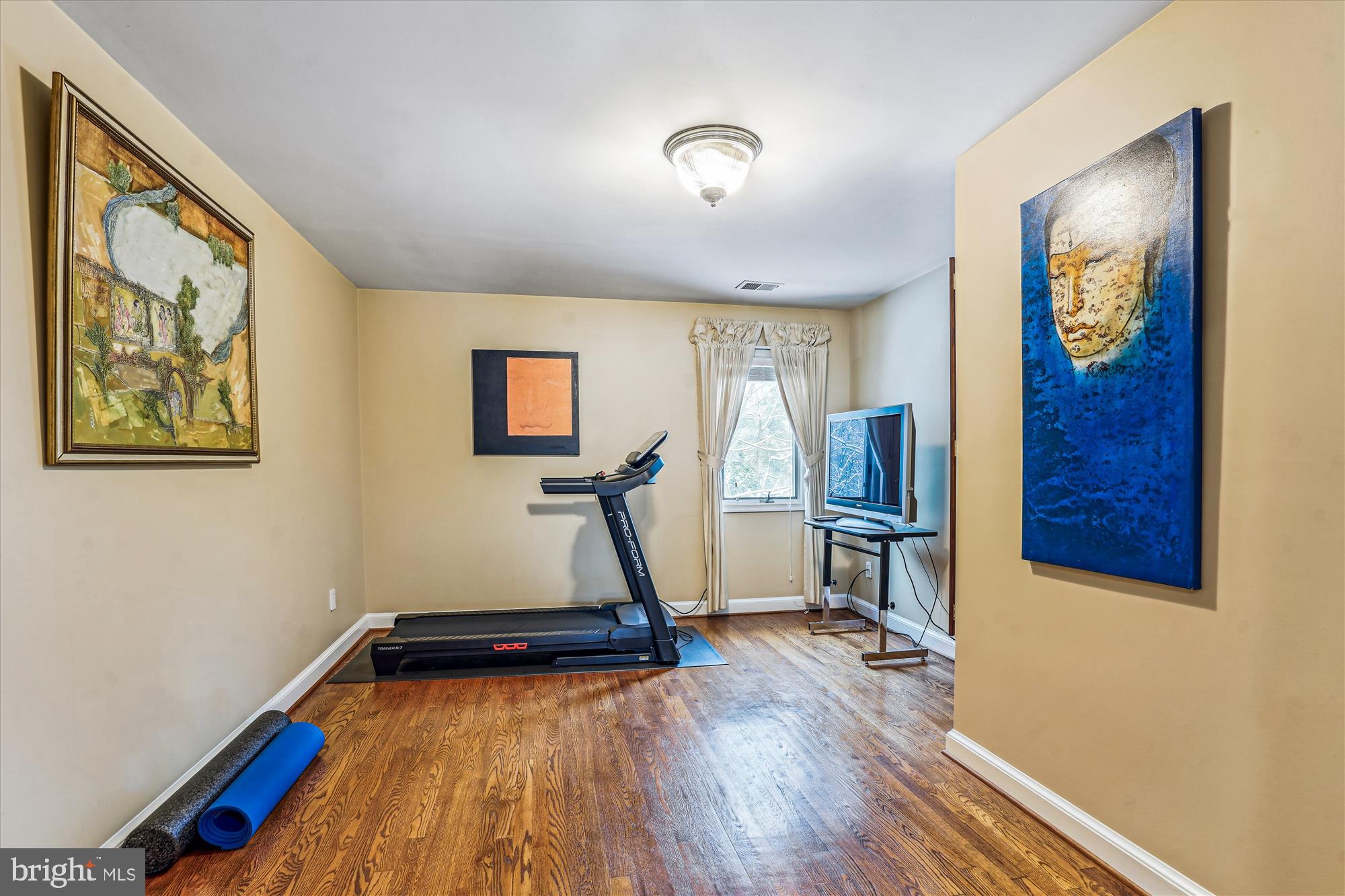 1071 Spring Hill Road McLean, VA 22102 - Photo 34 of 65 a room with wooden floor and a window