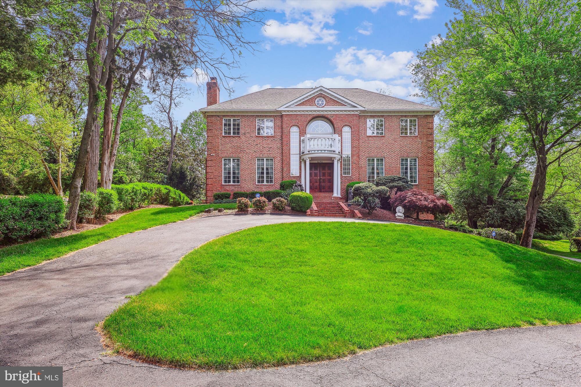 1071 Spring Hill Road McLean, VA 22102 - Photo 44 of 65 a front view of a house with garden