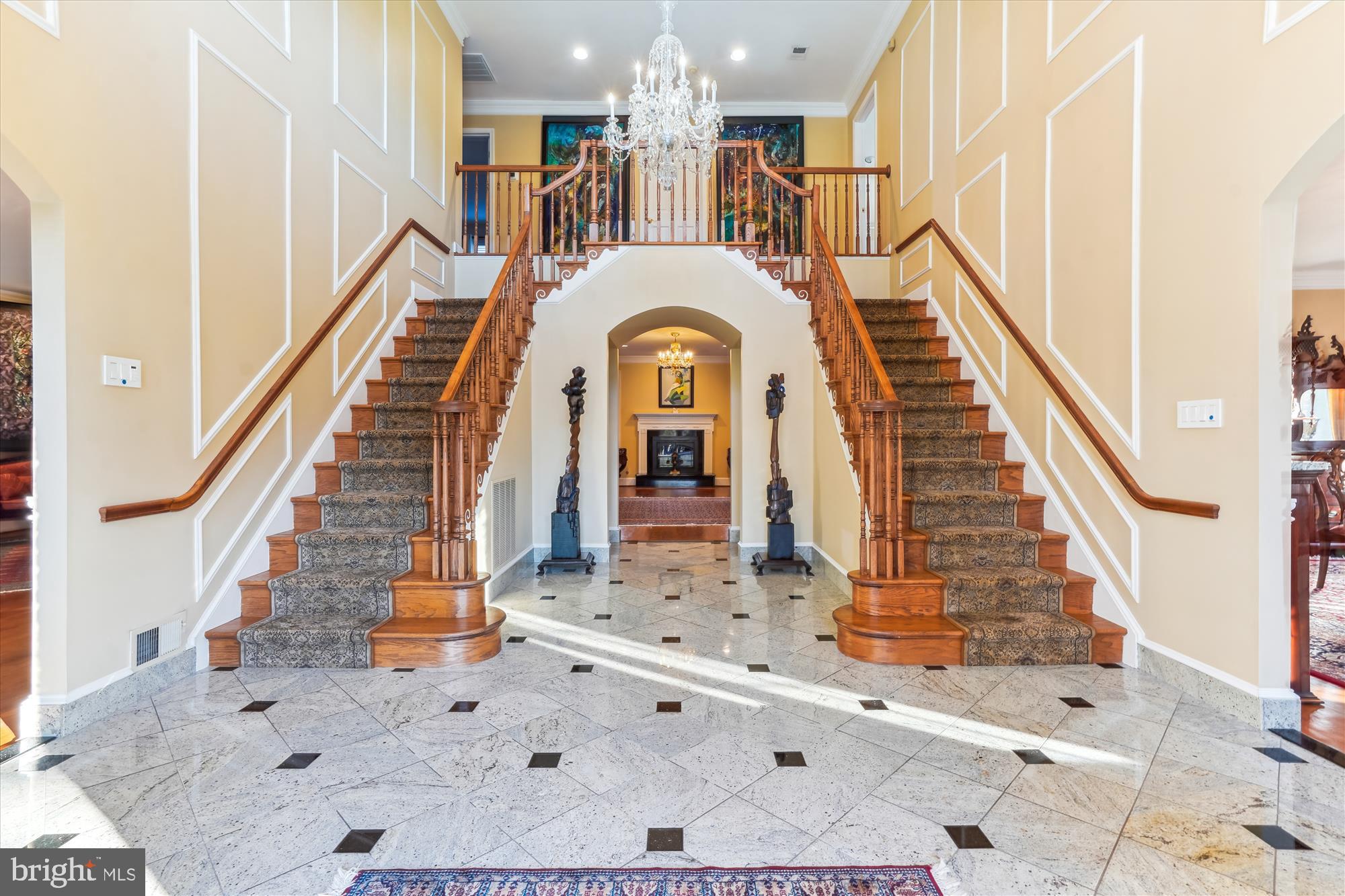 1071 Spring Hill Road McLean, VA 22102 - Photo 6 of 65 a view of a staircase with a rug and a chandelier