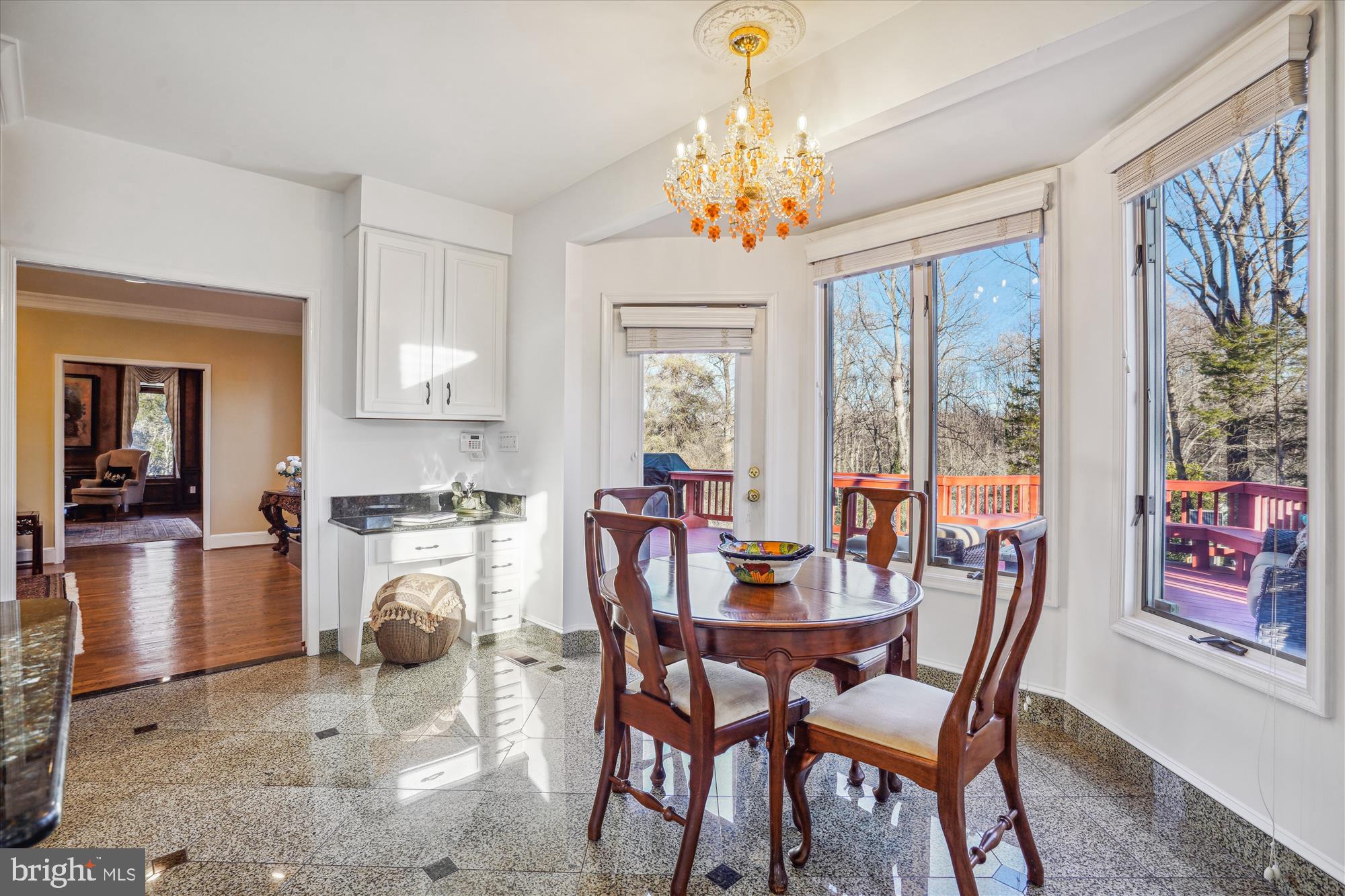 1071 Spring Hill Road McLean, VA 22102 - Photo 10 of 65 a view of a dining room with furniture a chandelier and wooden floor