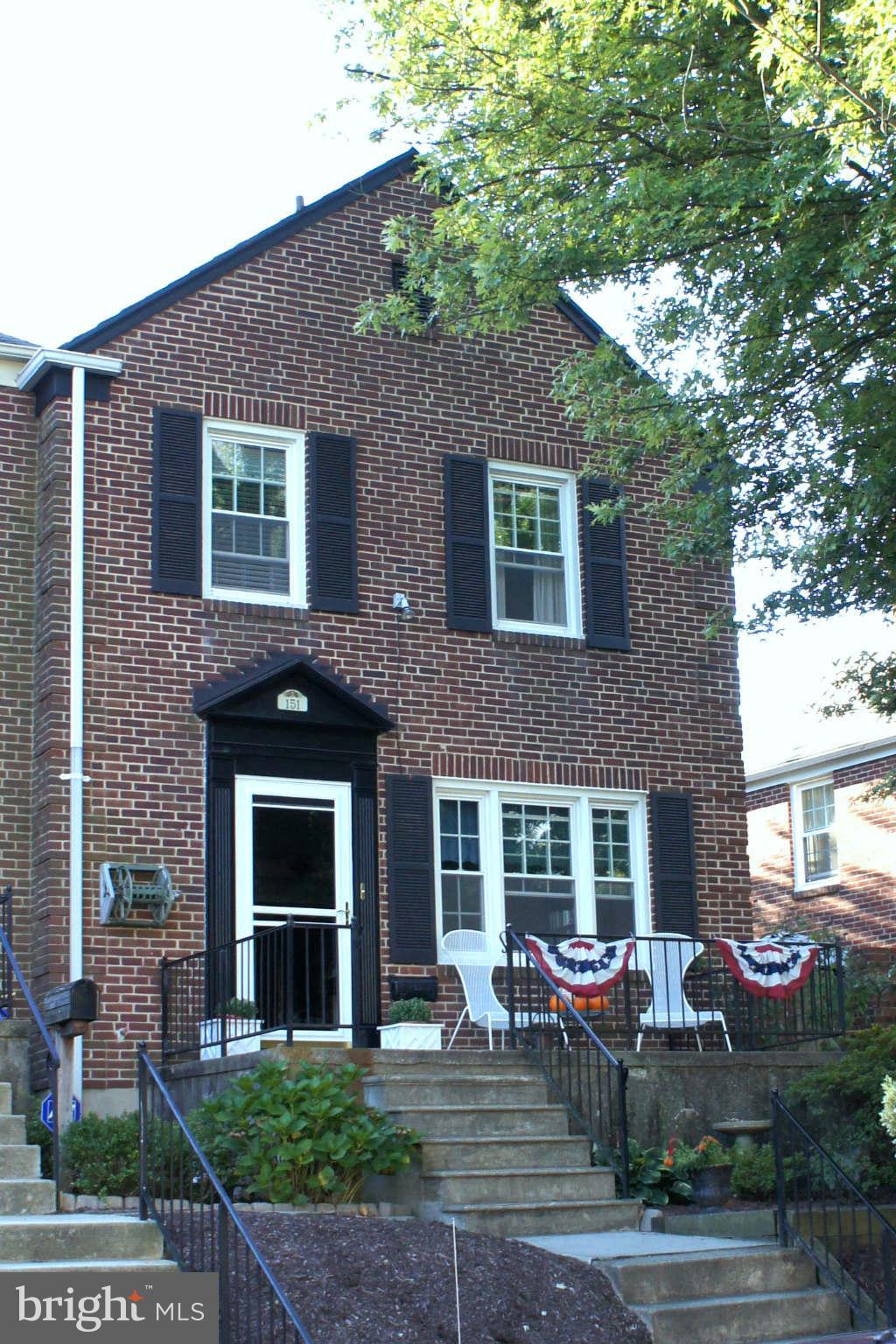 151 Stanmore Road Baltimore, MD 21212 - Photo 1 of 29 a front view of a house with yard and chairs