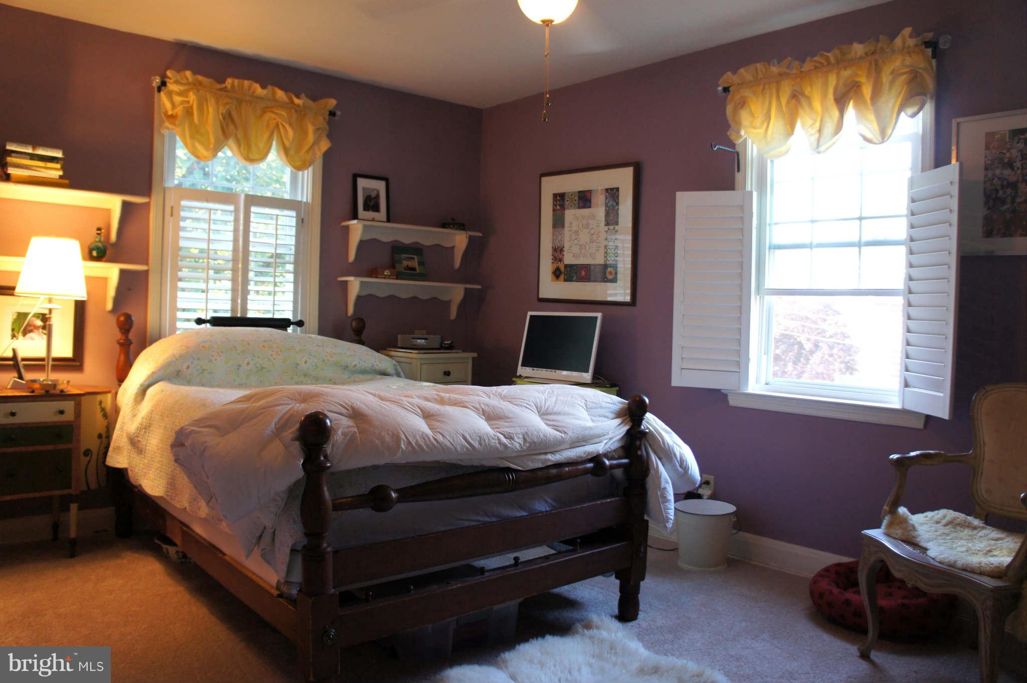 151 Stanmore Road Baltimore, MD 21212 - Photo 12 of 29 a bedroom with a bed and a tv