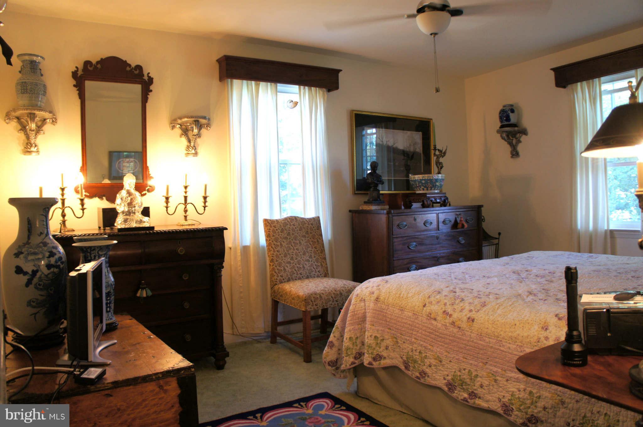 151 Stanmore Road Baltimore, MD 21212 - Photo 13 of 29 a bedroom with a bed and wooden floor