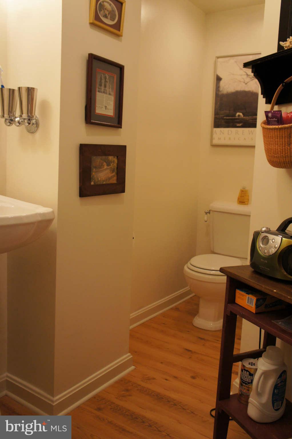 151 Stanmore Road Baltimore, MD 21212 - Photo 21 of 29 a bathroom with a toilet and a sink