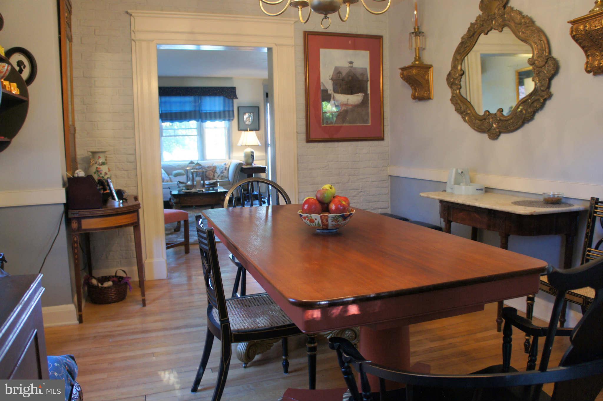 151 Stanmore Road Baltimore, MD 21212 - Photo 5 of 29 a dinning table and chairs in a room