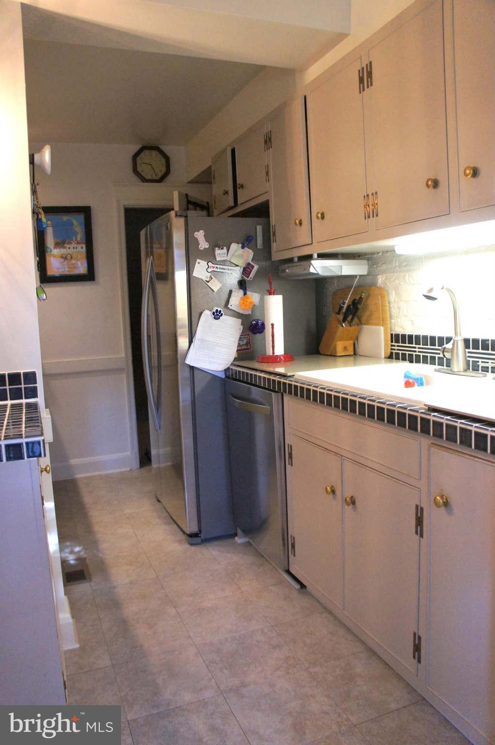 151 Stanmore Road Baltimore, MD 21212 - Photo 8 of 29 a kitchen with stainless steel appliances granite countertop a refrigerator and a stove