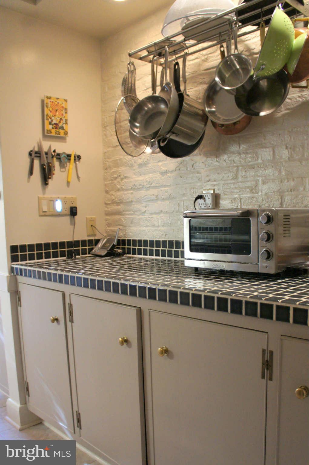 151 Stanmore Road Baltimore, MD 21212 - Photo 10 of 29 a kitchen with a stove and cabinets