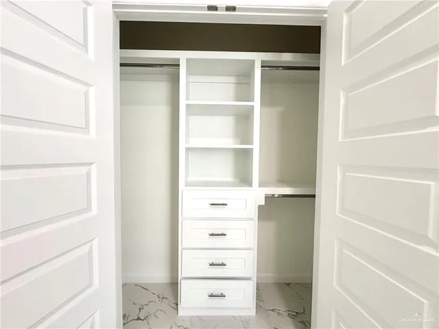 a view of an empty walk in closet