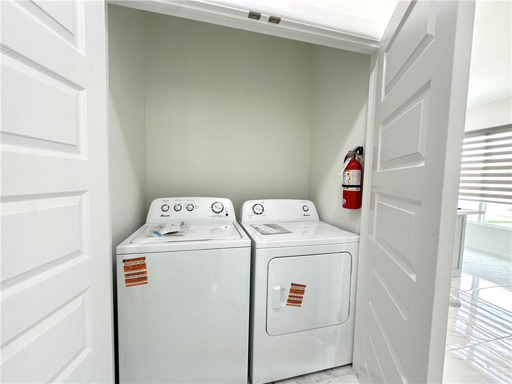 2404 East Viviana Street, Unit 1 Edinburg, TX 78542 - Photo 13 of 14 a utility room with dryer and washer