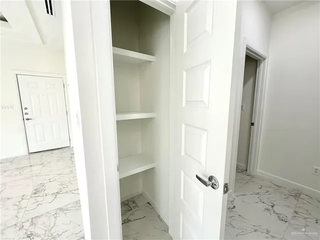 a view of a bathroom with a sink and a mirror