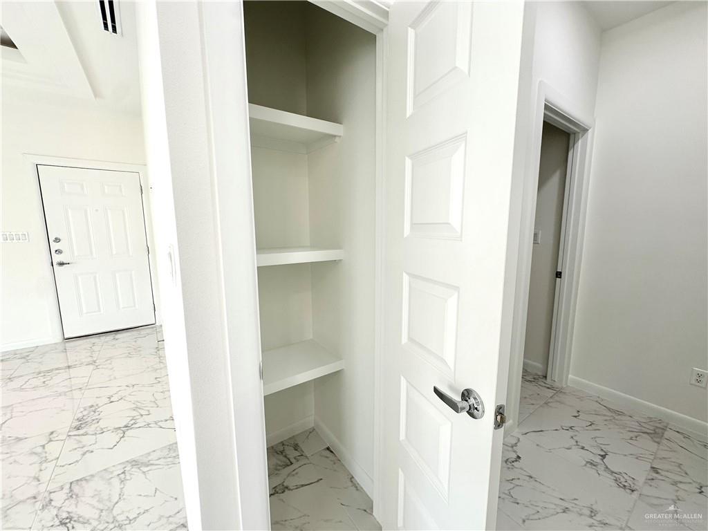 2404 East Viviana Street, Unit 1 Edinburg, TX 78542 - Photo 14 of 14 a view of a bathroom with a sink and a mirror