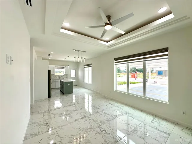 a view of a hallway with a chandelier