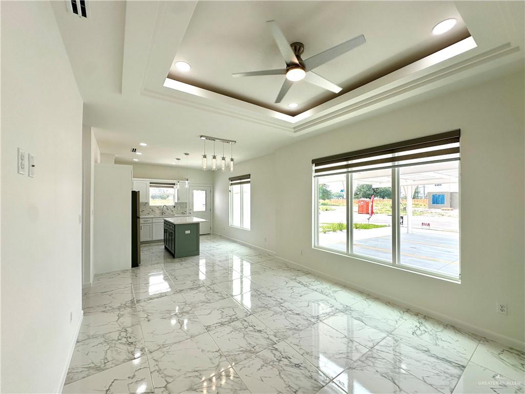 2404 East Viviana Street, Unit 1 Edinburg, TX 78542 - Photo 2 of 14 a view of a hallway with a chandelier