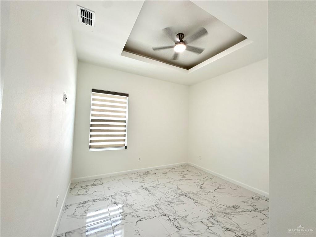 2404 East Viviana Street, Unit 1 Edinburg, TX 78542 - Photo 9 of 14 a view of an empty room with a window