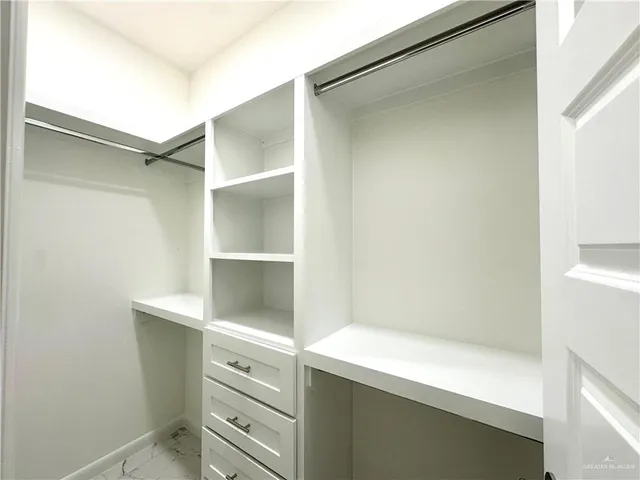 a view of an empty walk in closet