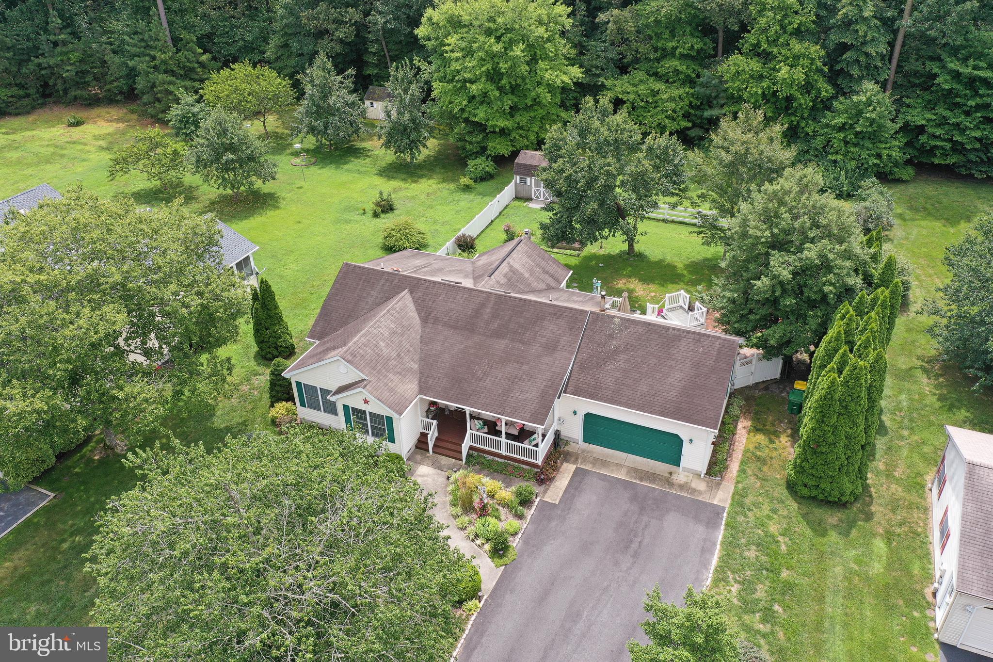 an aerial view of a house with big yard