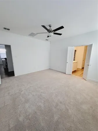 a view of a big room with carpet
