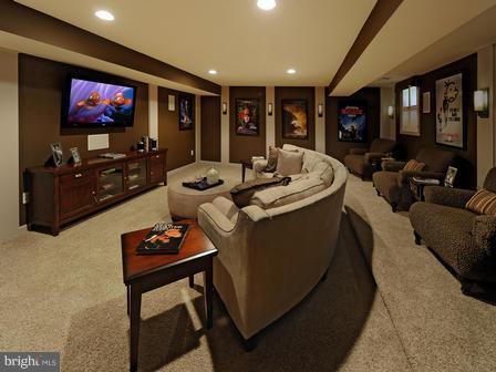 910 Gladway Road Baltimore, MD 21220 - Photo 17 of 18 a living room with furniture a flat screen tv and kitchen view