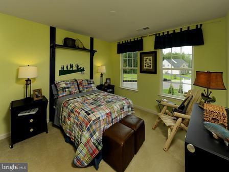 910 Gladway Road Baltimore, MD 21220 - Photo 3 of 18 a bedroom with a bed and large windows