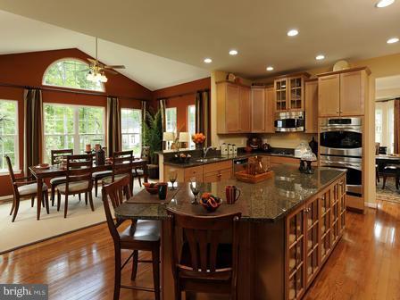 910 Gladway Road Baltimore, MD 21220 - Photo 5 of 18 a kitchen with lots of counter top space and furniture