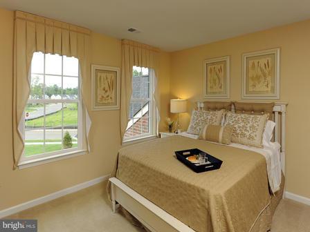 910 Gladway Road Baltimore, MD 21220 - Photo 6 of 18 a bedroom with a bed and a window