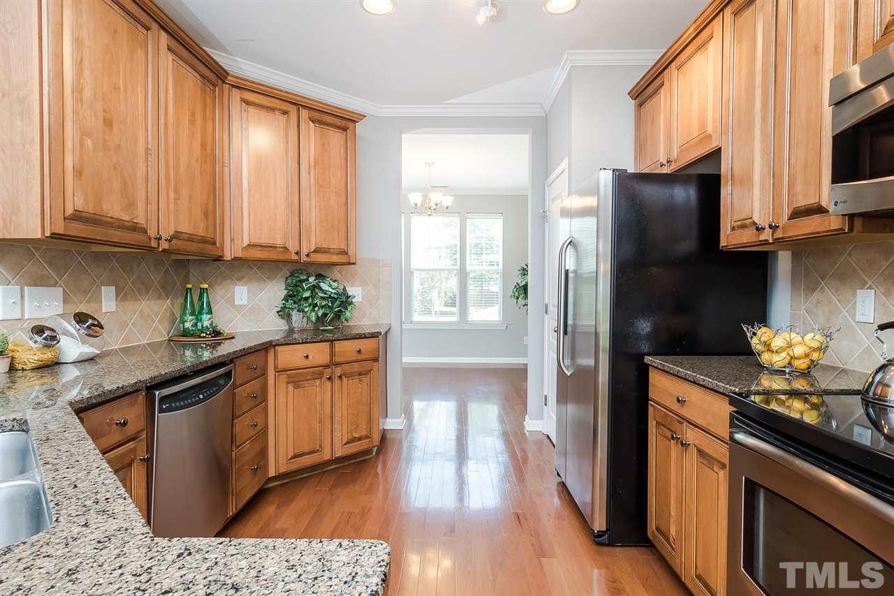 4624 Springerly Lane Raleigh, NC 27612 - Photo 2 of 11 Nice sized kitchen with GRANITE COUNTERS and STAINLESS STEEL appliances.