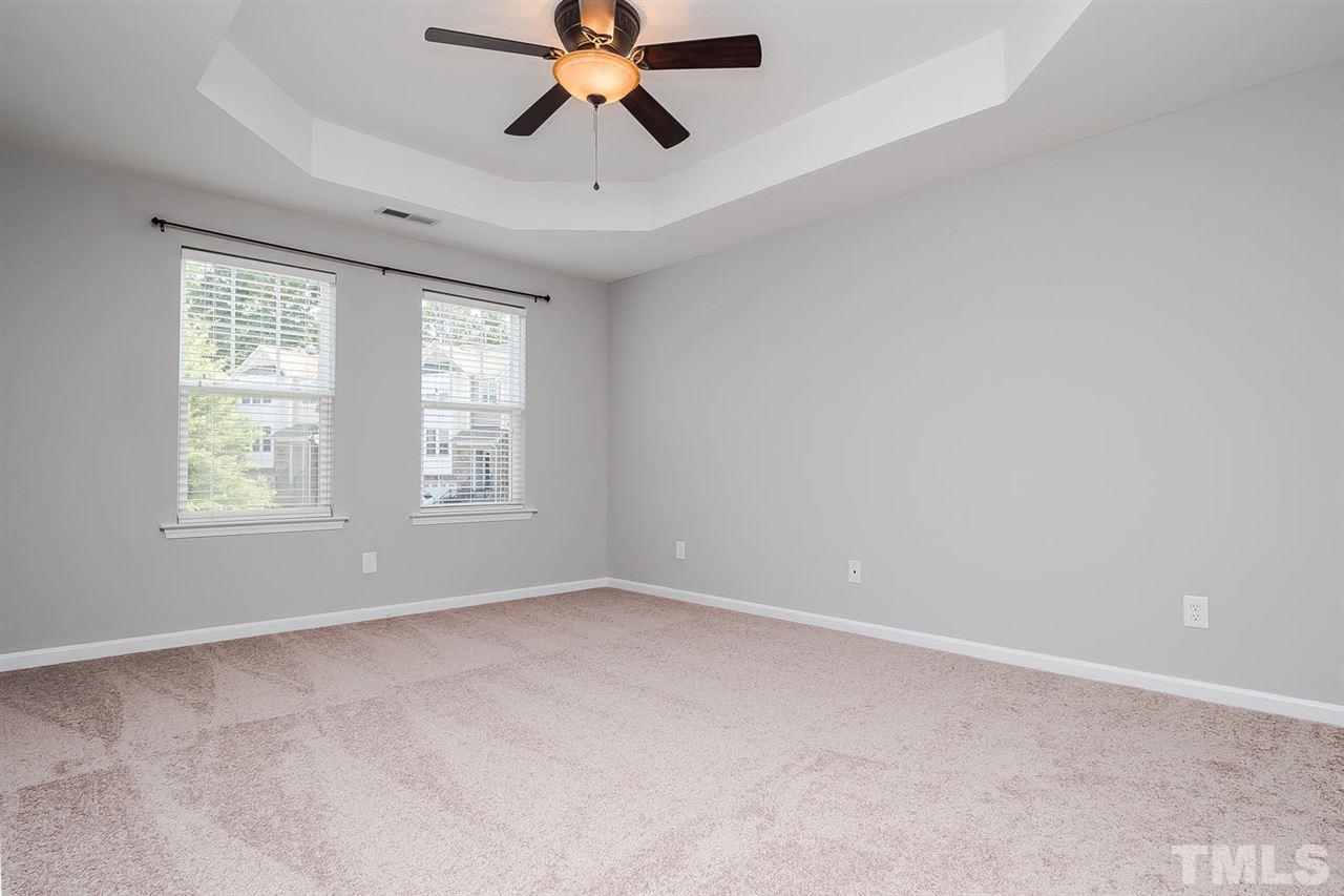 4624 Springerly Lane Raleigh, NC 27612 - Photo 3 of 11 This SPACIOUS master bedroom has a large WIC with window.