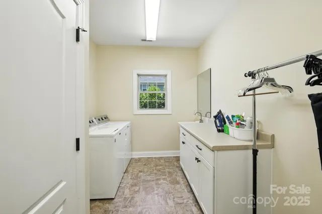 a spacious bathroom with a tub sink and mirror