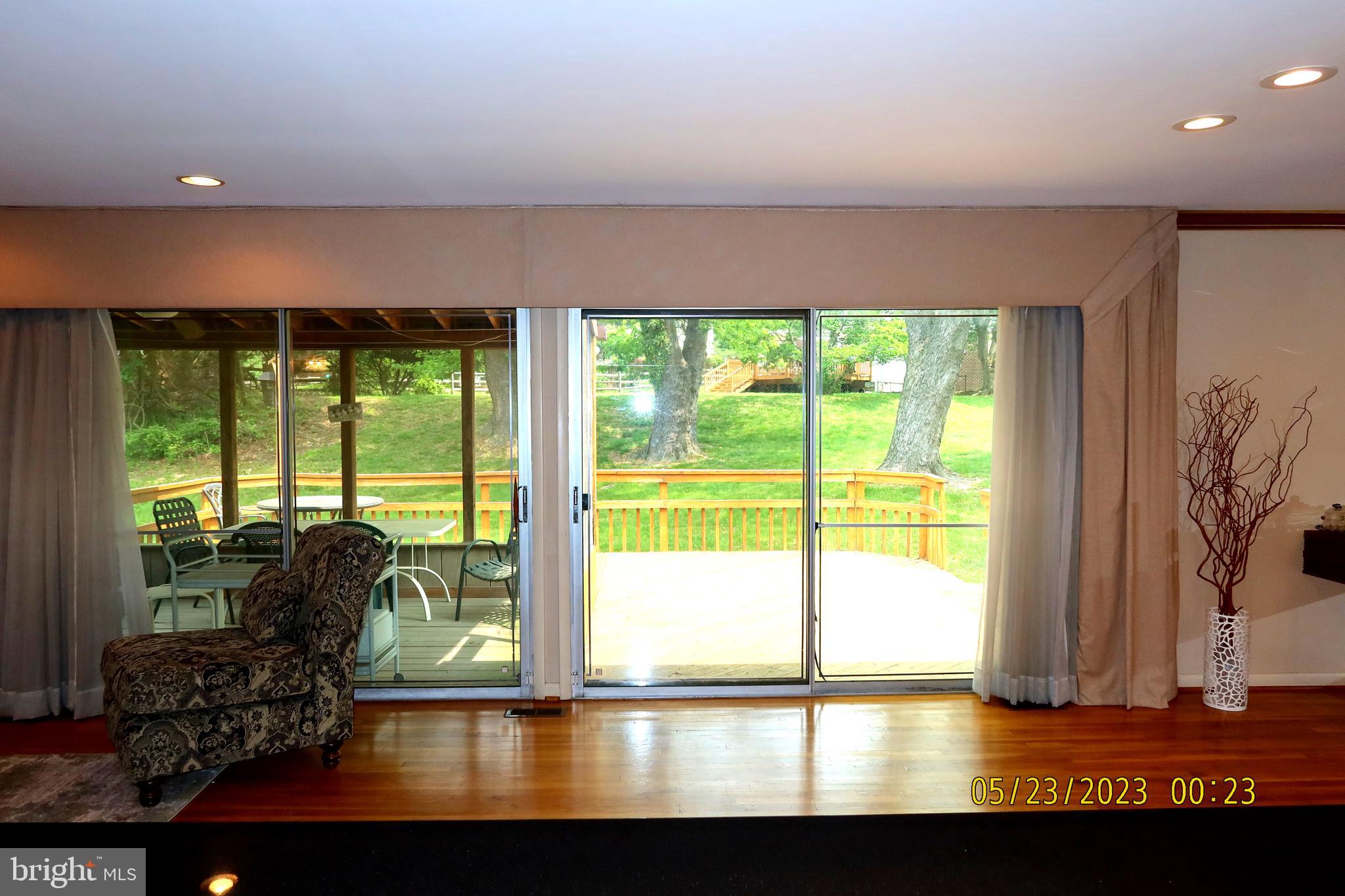 2202 Oxeye Road Baltimore, MD 21209 - Photo 17 of 51 Living Room with view of screened in porch