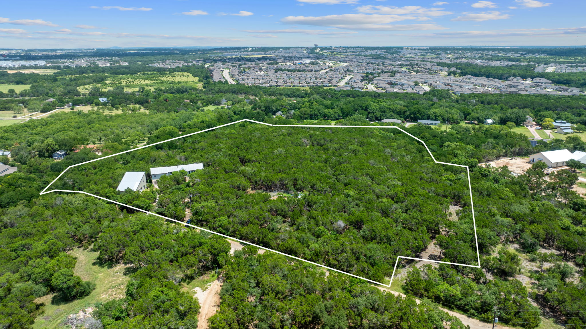 Tucked away on 10.4 serene acres at the top of Riva Ridge, this private hill country retreat offers the perfect balance of peaceful seclusion and city convenience.