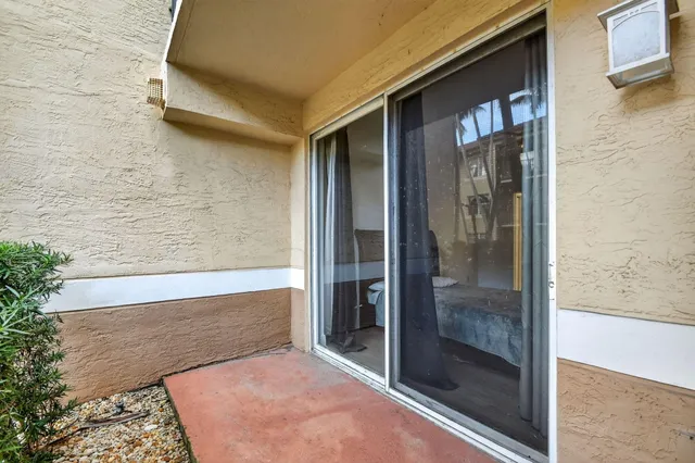 a view of a garden with a building