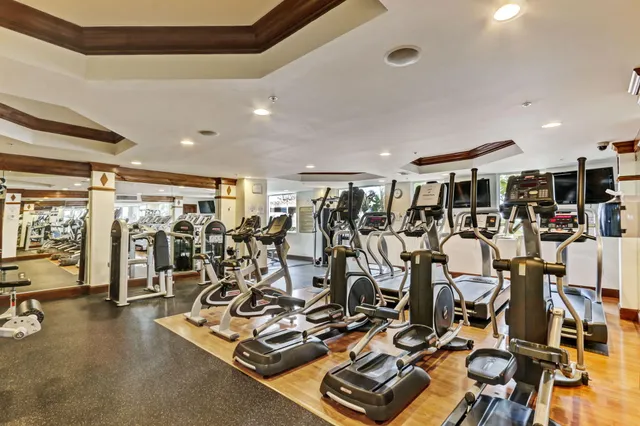 a living room with furniture a window and kitchen view